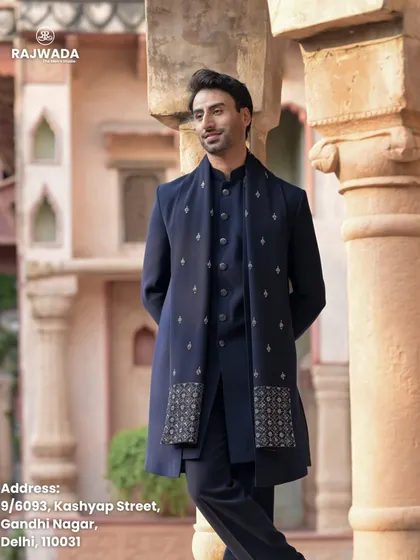 A full-length view of the navy blue Indo-Western outfit. The matching stole with delicate embroidery completes this elegant ensemble from the Riwayat collection, ideal for a reception or Sangeet.