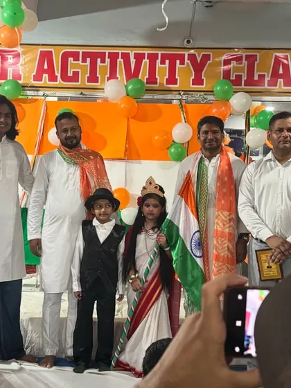 Our instructors and guests of honor posing for a photo with our young performers, who were dressed as national icons for the Independence Day celebration.