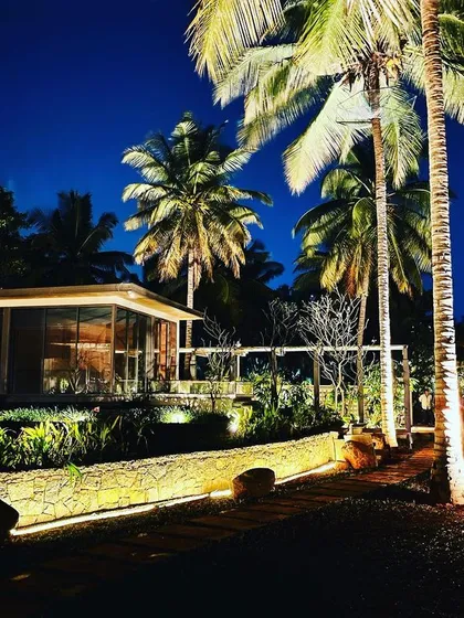 Night lighting is one of our specialties. By uplighting these tall palm trees and illuminating the garden path, we transformed this property into a dramatic and elegant space after dark.