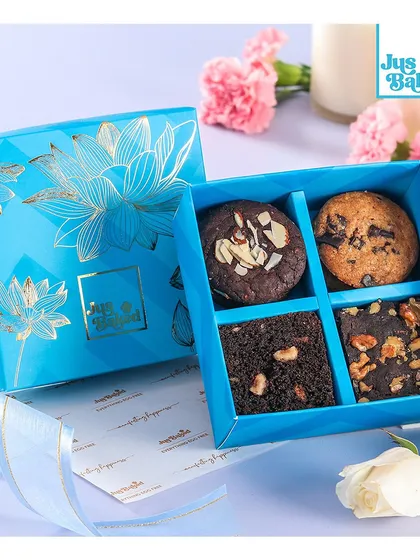 The 'Sutra Rakhi Hamper' contains a mix of our popular cookies and brownies, beautifully packed in our signature blue box.