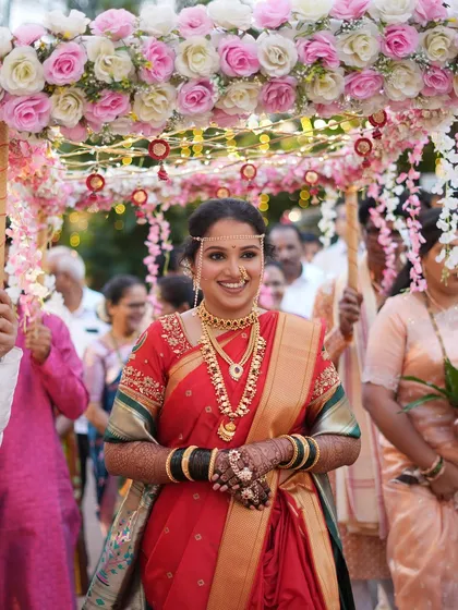 The bride's grand entrance under a floral canopy, a truly magical moment.