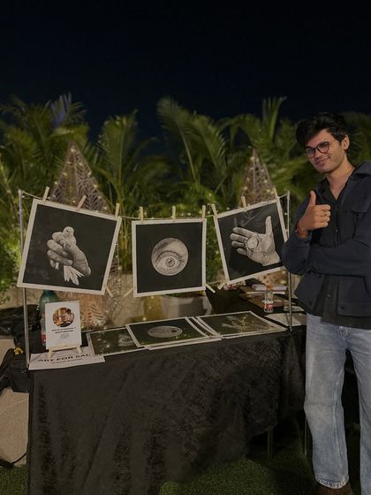 Me at an art display event, standing next to some of my original drawings from the 30-day challenge. It was a hectic but fun weekend of workshops and showcasing my art.