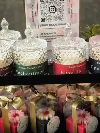 A close-up of my products at the Amity University exhibition. You can see the Crystal Jar candles and some of my floral gift boxes, all ready for customers.