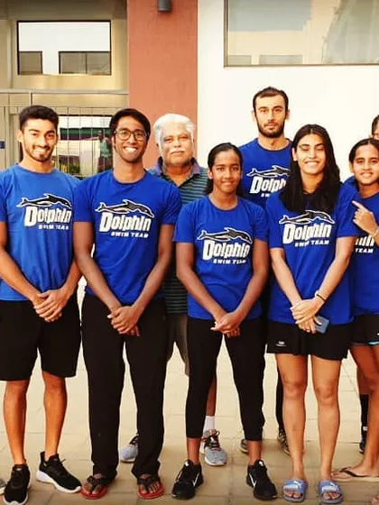 The full Dolphin Aquatics squad. When you train with me, you become part of a team that supports and pushes each other to be the best. We are a family of champions.