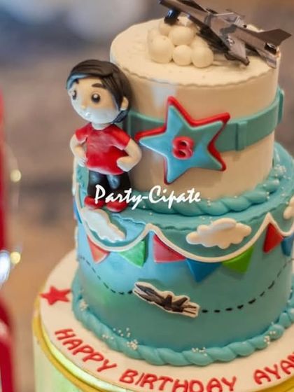 A close-up of the amazing fighter jet cake, complete with a little pilot figure and the birthday boy's age.