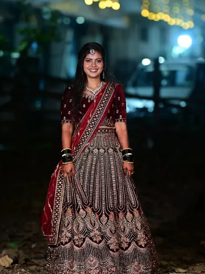 For Bhumika's reception, we went for a classic glamorous look. The makeup features a soft smokey eye and a neutral lip to balance her magnificent velvet lehenga, ensuring she was the star of the evening.