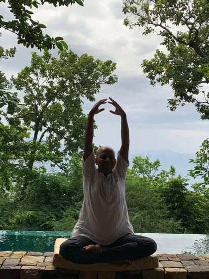Raising the arms during a seated meditation can help to open the heart and lengthen the spine. This movement encourages a feeling of receiving energy from above while staying grounded through your seat. It is a beautiful way to connect the earth and the sky within your own body.