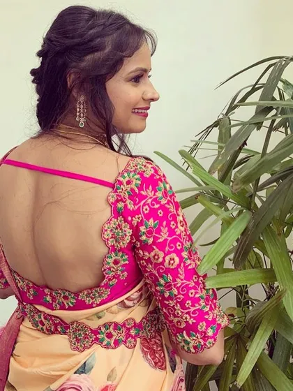 The deep back of this magenta blouse is highlighted by the intricate floral embroidery that frames it. It’s a perfect example of how I can customize every detail to your preference.