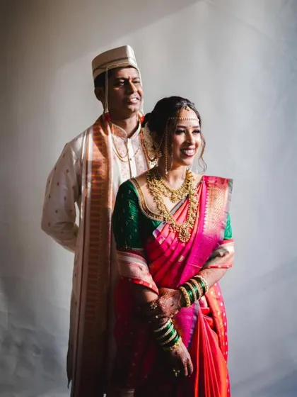 A symphony of pink, orange, and gold in this traditional Paithani saree. I loved draping this for a beautiful Maharashtrian bride, ensuring the rich fabric and colors created a picture-perfect wedding look.