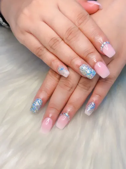 A beautiful engagement set featuring a soft pink ombre with silver glitter accent nails and delicate rhinestone details at the cuticle.