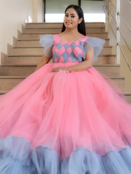 Here's a look at one of our custom-designed ball gowns, worn by the lovely Suguna. The unique pink and grey checkered bodice and full tulle skirt make it a real showstopper for any event or portfolio shoot.
