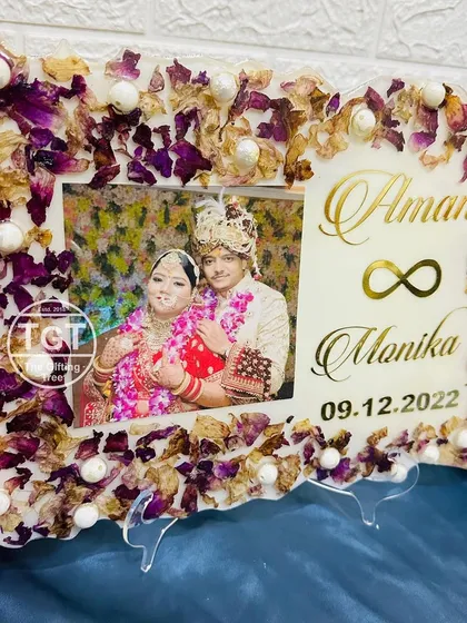 The pink and white floral frame shown on its stand, perfect for tabletop display.
