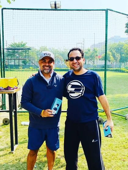 A coach and player celebrating the victory of TUG Blaster 2.0.