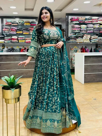 This dark green printed lehenga is our pick for the second day of Navratri. The rich color and traditional motifs are perfect for the festive season.