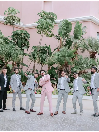The groom and his groomsmen, looking sharp and ready for the big day.