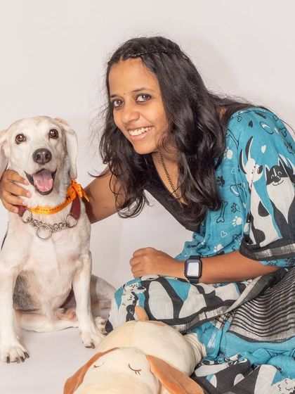 A sweet and gentle portrait of Kavitha with her adopted beagle, Seenu. This image captures the quiet, loving moments that rebuild trust and connection.