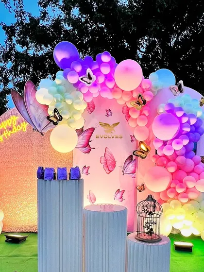 A full view of the pastel butterfly theme at dusk, with lighting that makes the colors pop and creates an enchanting atmosphere.
