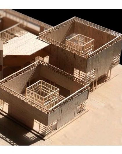 A close-up of the roofless model, showing the 'courtyard within a courtyard' concept. The play of light and shadow within these nested spaces is a key part of the architectural experience we aim to create.