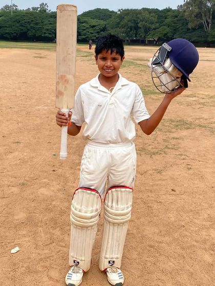 A full-length shot of Arnav after his 130 not out innings, capturing the gear and the ground where it happened.