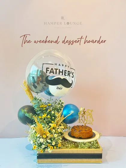 For the weekend dessert hoarder, this hamper is a dream. It features a delicious cake, a festive balloon, and a beautiful floral arrangement, making it a complete celebration in a box.