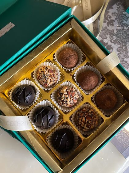 An assortment of our most popular truffle flavors, including dark chocolate, roasted almond, and classic cocoa, ready for gifting.