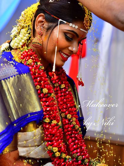 The joy of a bride on her wedding day. This candid shot captures the happiness and radiance of the moment, with makeup designed to look beautiful from every angle.