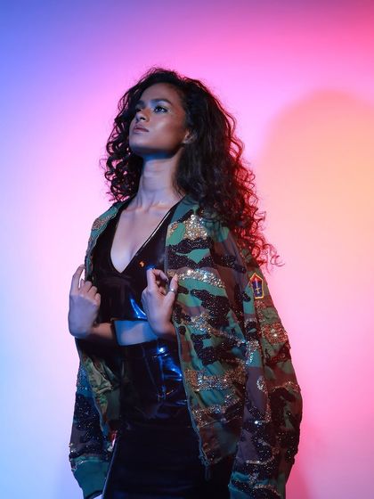 Using colored gel lights to create a vibrant, high-energy mood for a western wear lookbook. The studio is equipped with professional lighting gear to achieve any desired aesthetic, from soft and natural to bold and dramatic.