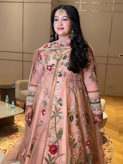 This bride is glowing from within. Her Roka makeup is all about enhancing her natural radiance with a dewy finish and soft, romantic colors.