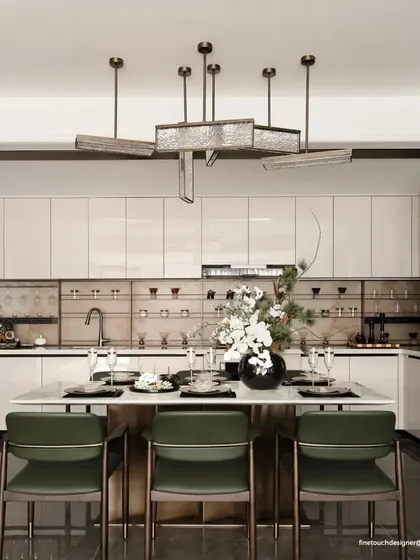 A modern kitchen should be both beautiful and highly functional. This design features an integrated dining island, sleek handleless cabinetry, and specialized glass storage, creating a perfect space for cooking and socializing.