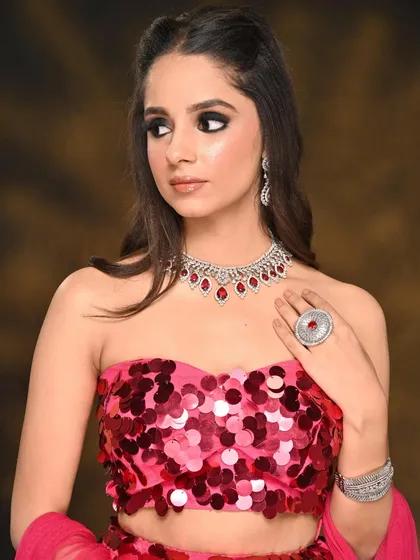 A side profile showcasing the dramatic black smokey eye. The blending extends outwards to elongate the eye, creating a fierce and captivating look for this fashion shoot.