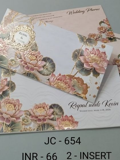 This card is decorated with a border of embossed lotus flowers in shades of pink and gold. The textured details give the invitation a premium feel, perfect for a special celebration.