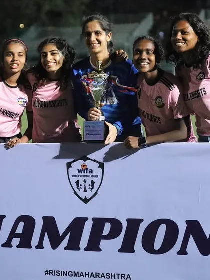 Players and staff posing with the WIFA championship trophy. This victory belongs to everyone in the Mumbai Knights family.
