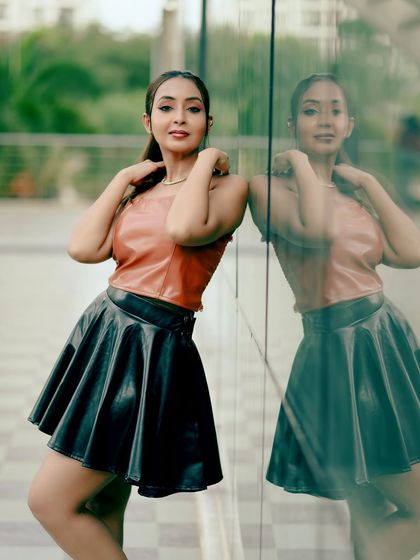 A similar pose, this time with the model looking directly at the camera, creating a confident and engaging image.