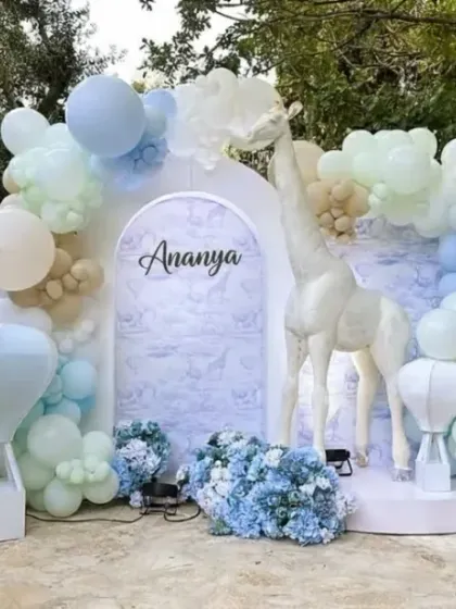 The full view of Ananya's pastel animal-themed first birthday, including a large light-up number '1' that makes for a perfect photo opportunity.