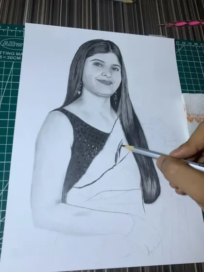 Further along in the process, this image shows me working on the hair and saree, with the face now complete.