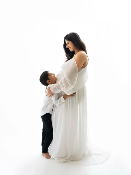 There's a special kind of glow that every mommy-to-be has. In the studio, we can create these elegant, classic portraits that celebrate this incredible time in your life, showing the beautiful bond you already share with your little one.