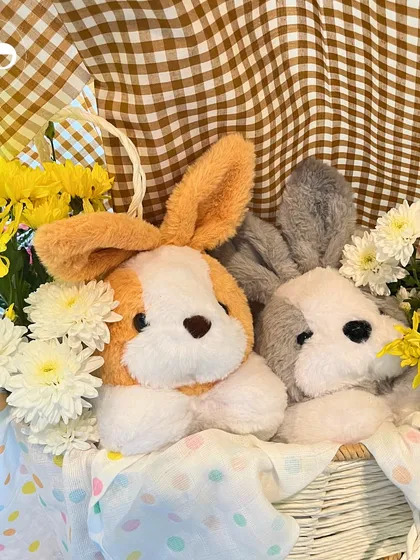 How sweet are these bunny plushies nestled in a basket of flowers? This charming detail from our farm themed baby shower added an extra dose of cuteness to the decor.