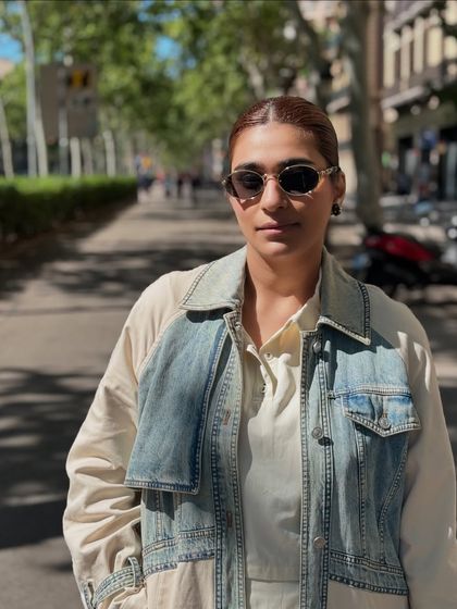 My street style look, featuring a denim vest layered over a simple shirt. It's a fun way to play with textures and add some edge to a casual outfit.