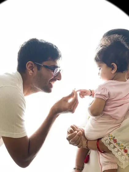 A tender moment between father and child, highlighted with beautiful backlighting. This style is perfect for capturing pure and simple connections.