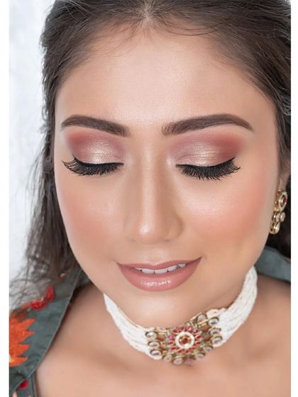 A close-up of perfectly executed eye makeup. The soft, shimmery eyeshadow and flawless blending create a subtle yet impactful look, ideal for an engagement or bridesmaid.