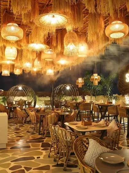 For the Sesh rooftop cafe in Delhi, I brought the laid back vibe of Goa to the city. The design is built around natural materials, with a ceiling of hanging straw and rattan furniture that invites you to relax and unwind.