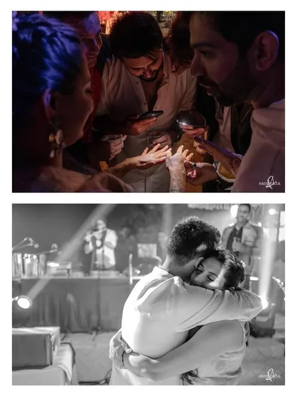 A groom searches for his name in his bride's mehendi by the light of phone torches. Below, they share a hug on the dance floor. These two images show the blend of playful and romantic intimacy.