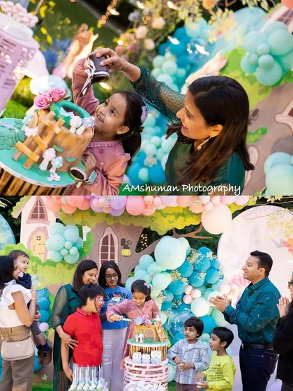 Capturing the joy of the moment is what it's all about. The birthday girl's delight is clear as she celebrates with her family, cutting into a custom-designed cake that is a miniature work of art itself.