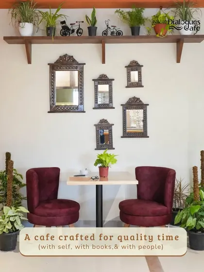 I've designed every corner to be a space for quality time. This spot, with its plush chairs and surrounding greenery, is perfect for a quiet conversation, a good book, or just a moment to yourself.