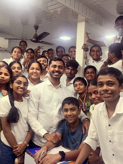 Our mentor with a group of students, all in white, ready to start the Navratri festivities with positive energy.