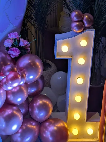 A close-up of the marquee light-up number '1'. These are very popular for first birthdays and make a great prop for photos.