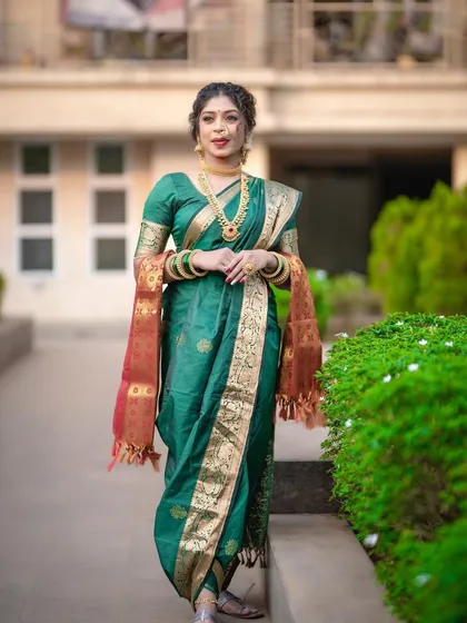 A full view of a classic green Nauvari saree, draped in the traditional Peshwai style. Learning this drape empowers you to create iconic Maharashtrian bridal and festive looks with confidence.