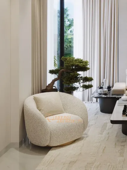 A close-up of the textured bouclé armchair and bonsai tree, details that bring organic warmth and a touch of nature into this modern living space.