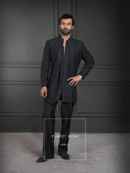Black, the shade of mystery and strength, brought alive with geometric textures and looped buttons. This layered look is a reflection of India’s regal legacy reimagined.