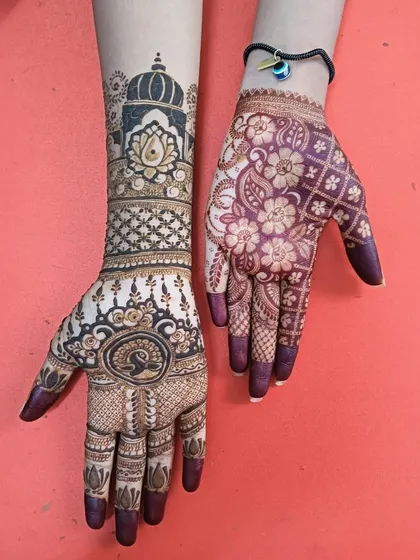 My students learn to master different styles. Here you can see two distinct designs side by side, one featuring a beautiful architectural dome and the other a lovely floral pattern with a rich stain.